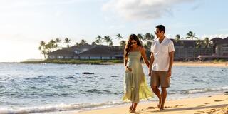 A couple walks hand in hand along a serene beach at sunset, surrounded by palm trees and ocean waves, radiating joy and tranquility.