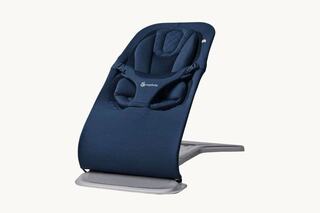A sleek, navy blue baby bouncer with a padded seat and safety harness, designed for comfort and support. Ideal for infants.
